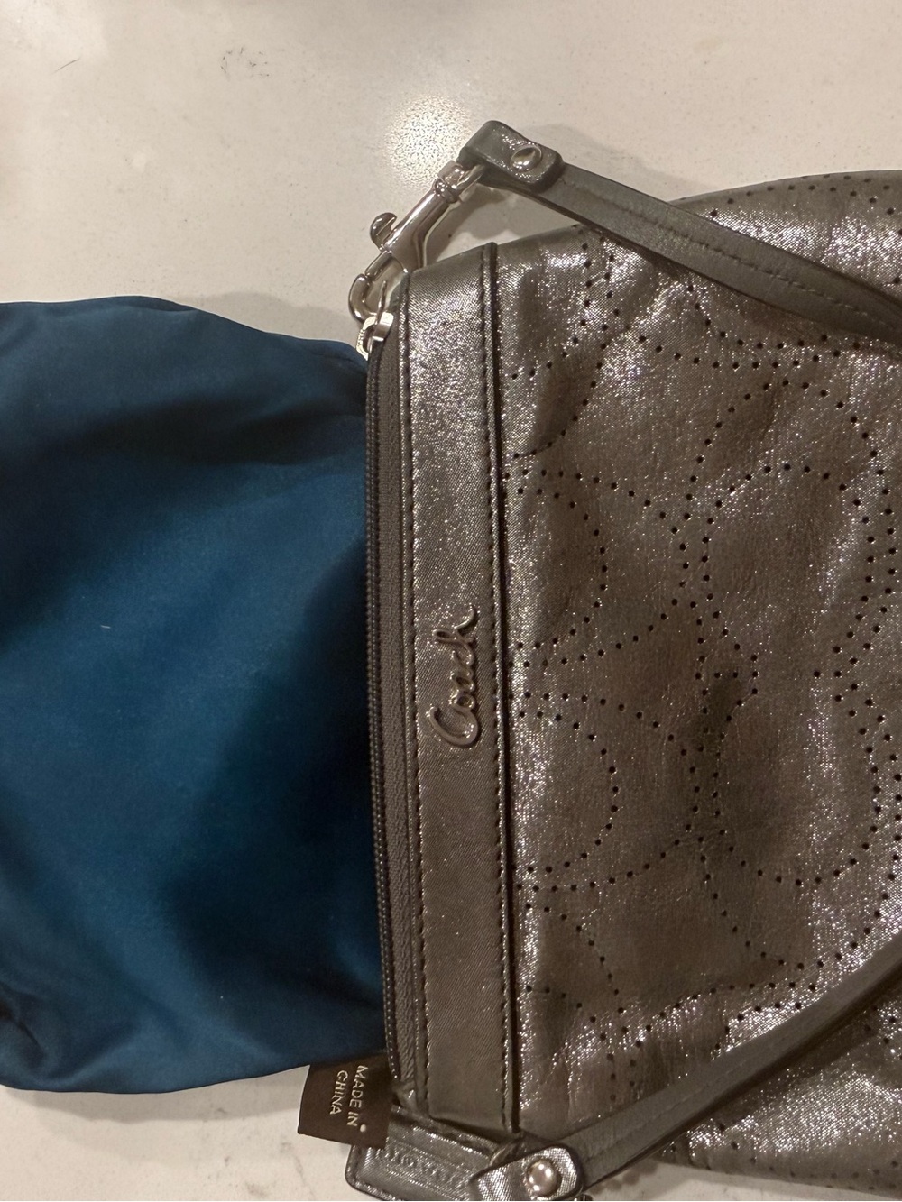Coach Metallic Pewter Perforated Wristlet